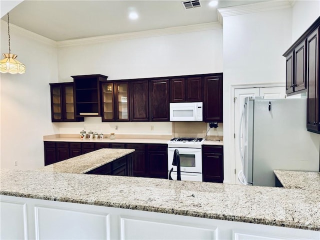 kitchen featuring light stone countertops, white appliances, visible vents, and crown molding