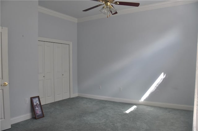 unfurnished bedroom with ornamental molding, a closet, carpet flooring, and baseboards