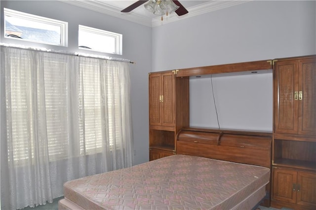 bedroom featuring ceiling fan and ornamental molding