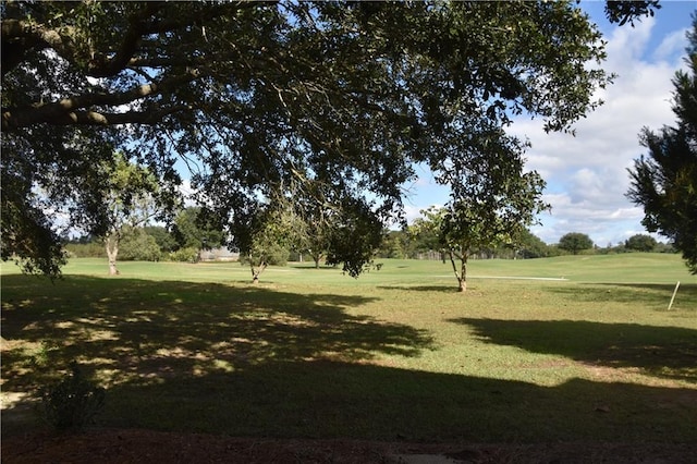 view of home's community featuring a lawn