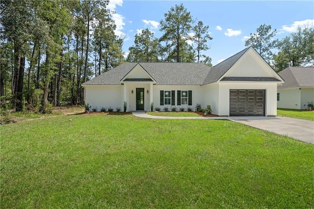 ranch-style house featuring a front yard and a garage