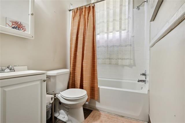 full bathroom with toilet, shower / bath combo, and vanity