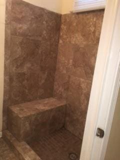 bathroom featuring walk in shower