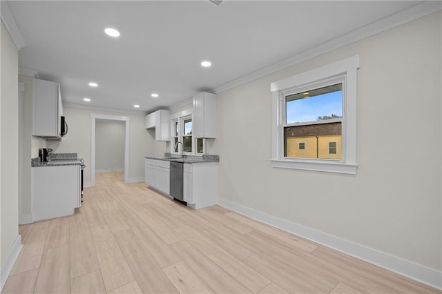 kitchen with stainless steel appliances, white cabinets, light hardwood / wood-style flooring, and crown molding