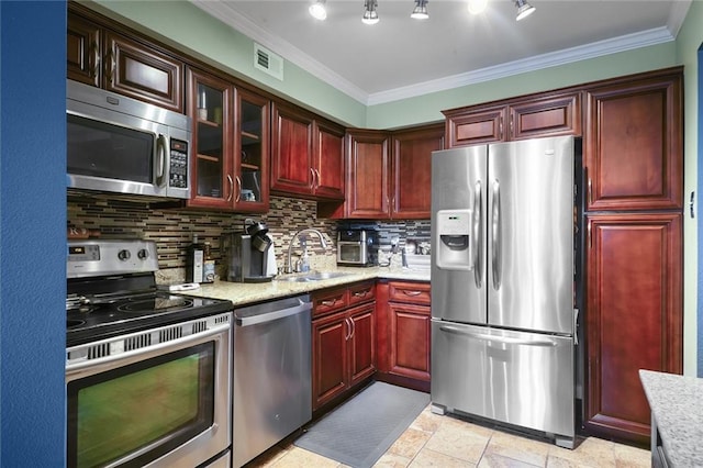 kitchen featuring sink, light stone countertops, ornamental molding, tasteful backsplash, and stainless steel appliances