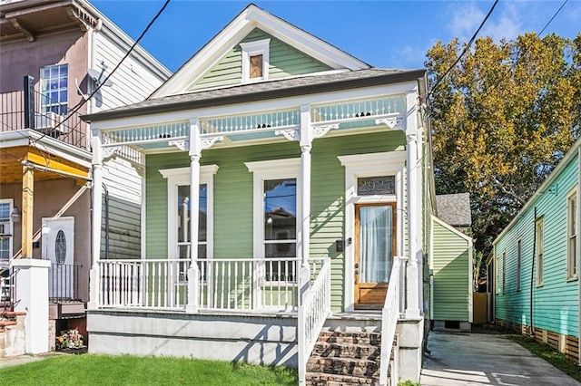 2927 Palmyra St, New Orleans, LA 70119 - shotgun-style home featuring covered porch