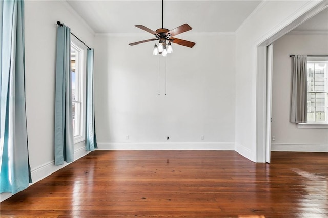 spare room featuring ceiling fan, dark hardwood / wood-style floors, and crown molding