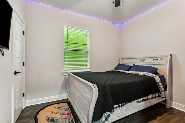 bedroom featuring dark hardwood / wood-style flooring and ceiling fan