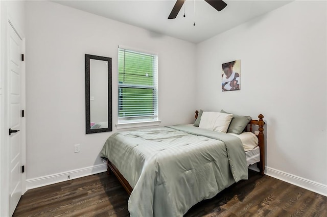 bedroom featuring dark hardwood / wood-style flooring and ceiling fan