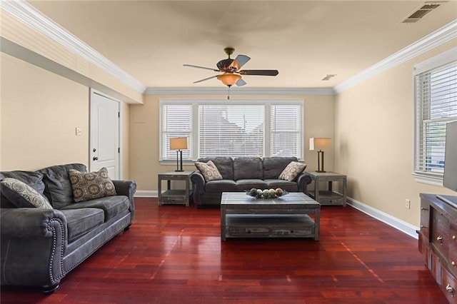 living room with a healthy amount of sunlight, crown molding, ceiling fan, and dark wood-type flooring