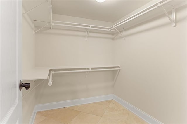 walk in closet featuring tile patterned floors