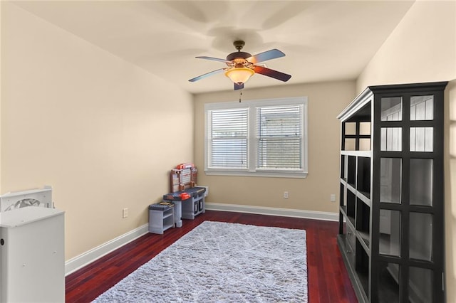 interior space featuring dark hardwood / wood-style flooring and ceiling fan