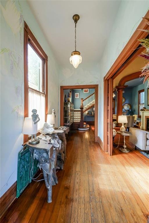 hall with hardwood / wood-style flooring