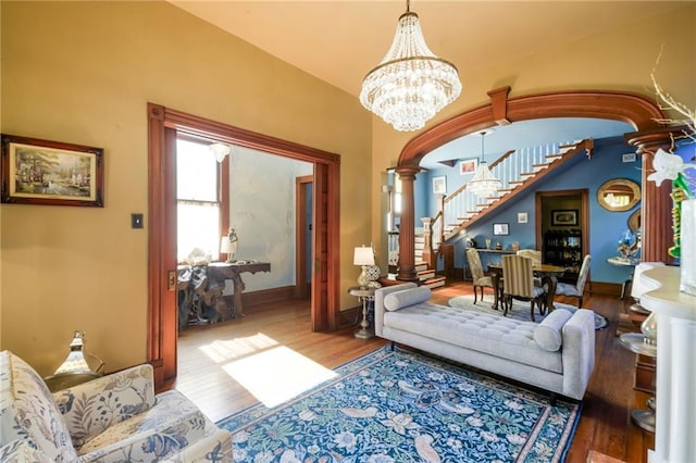 living room featuring hardwood / wood-style floors and ornate columns