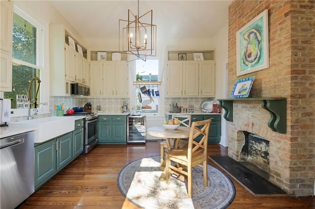 kitchen with stainless steel appliances, wine cooler, backsplash, dark hardwood / wood-style flooring, and hanging light fixtures