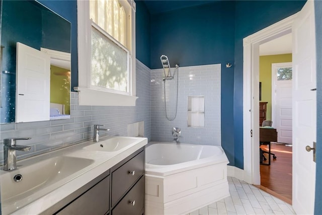 bathroom featuring vanity, plus walk in shower, and tile patterned floors