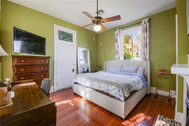 bedroom with dark wood-type flooring and ceiling fan