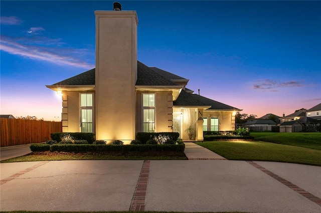 view of front of property with a lawn