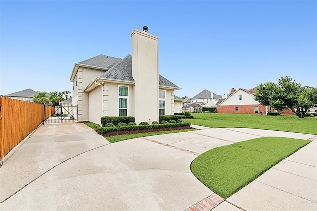 view of side of home featuring a yard