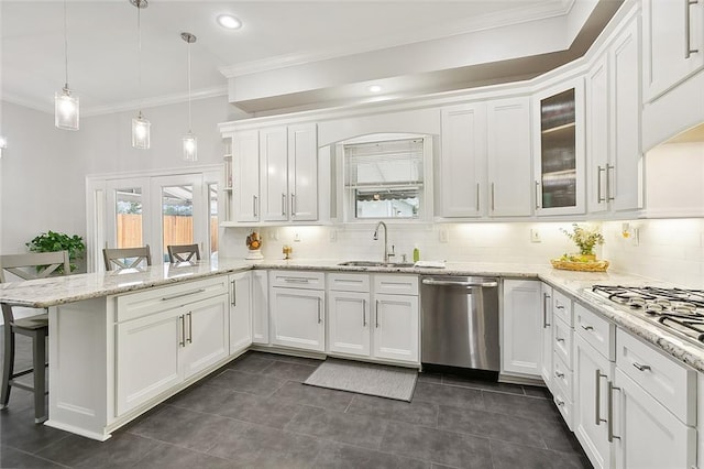 kitchen with white cabinets, a kitchen breakfast bar, and stainless steel appliances