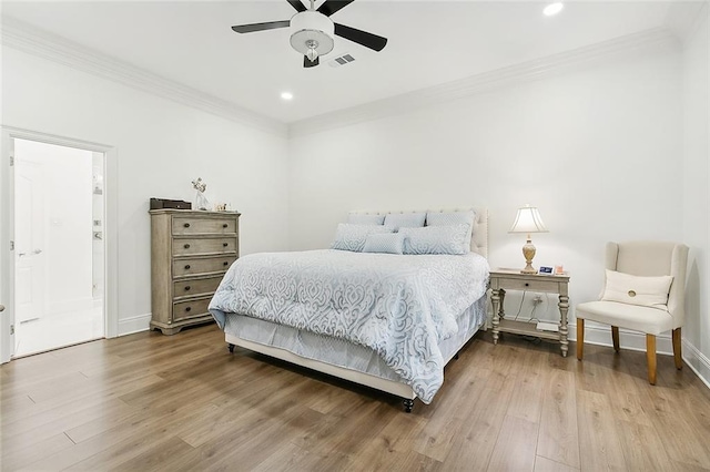 bedroom with ensuite bathroom, hardwood / wood-style flooring, ceiling fan, and crown molding