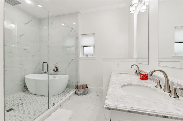 bathroom featuring independent shower and bath, vanity, and a healthy amount of sunlight