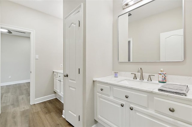 bathroom with vanity and hardwood / wood-style flooring