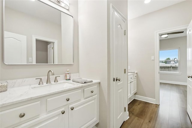 bathroom featuring hardwood / wood-style floors and vanity