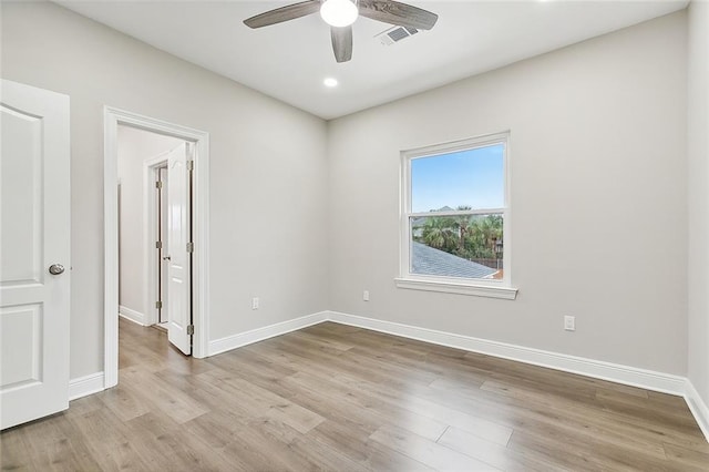 unfurnished room with ceiling fan and light hardwood / wood-style flooring