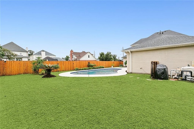 view of yard with a fenced in pool