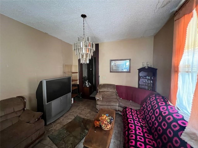 living room with a notable chandelier and a textured ceiling