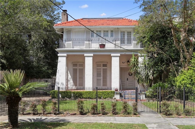 view of front of house featuring a porch and a balcony