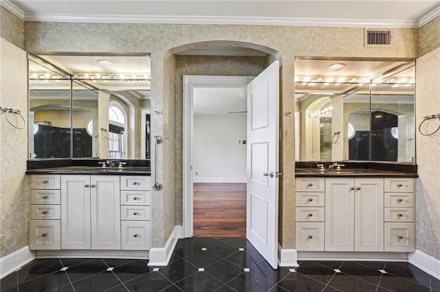 bathroom with tile patterned floors, vanity, and ornamental molding