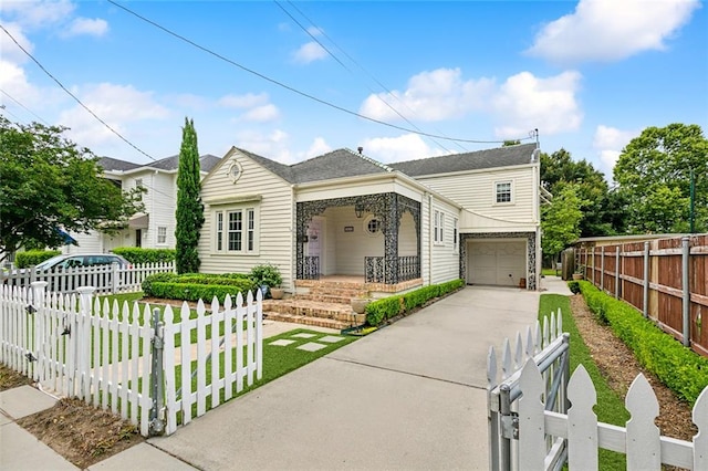 view of front of home featuring a porch and a garage