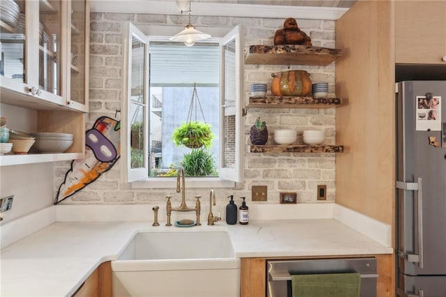 kitchen featuring stainless steel refrigerator, sink, and wine cooler