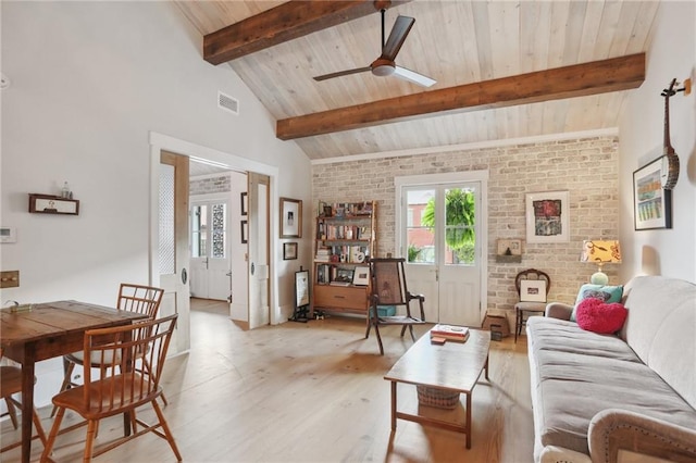 living room with wood ceiling, light wood-type flooring, ceiling fan, brick wall, and beam ceiling