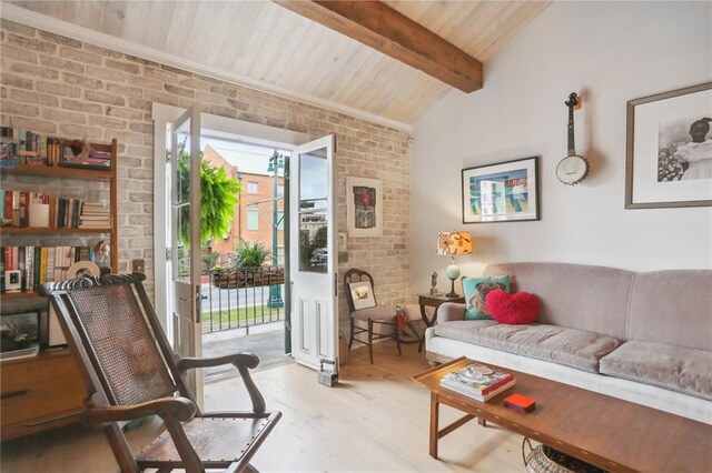 living room with wooden ceiling, ceiling fan, beam ceiling, light hardwood / wood-style floors, and brick wall