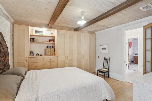 bedroom featuring beamed ceiling, brick wall, wood ceiling, and light hardwood / wood-style floors