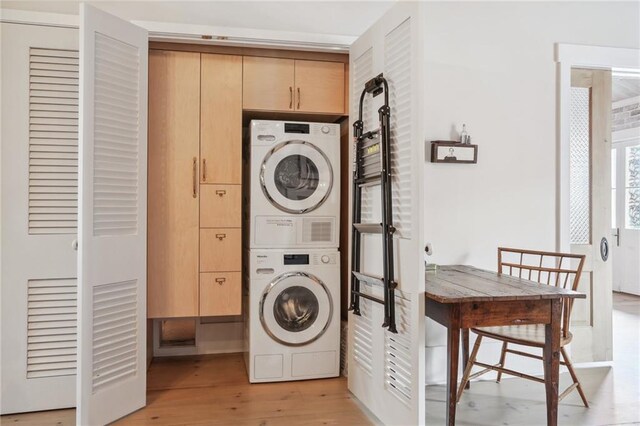 bathroom with a washtub, vanity, and hardwood / wood-style floors