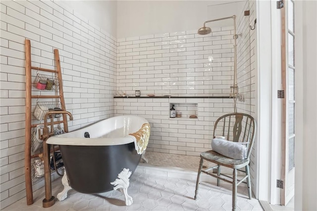 bathroom featuring tile patterned floors and separate shower and tub