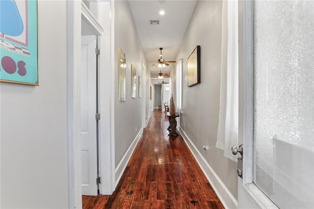 corridor with dark hardwood / wood-style floors