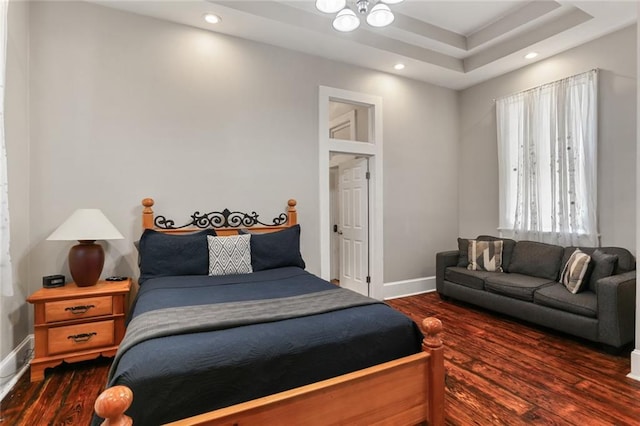 bedroom featuring dark hardwood / wood-style flooring