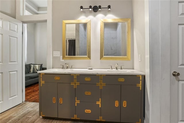 bathroom featuring vanity and hardwood / wood-style flooring