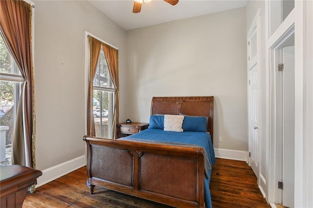 bedroom with ceiling fan and dark wood-type flooring