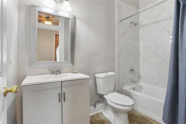 full bathroom with ceiling fan, hardwood / wood-style floors, shower / bath combination with curtain, toilet, and vanity