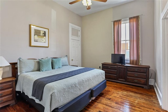 bedroom with ceiling fan and dark wood-type flooring