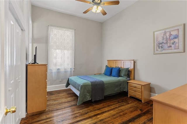 bedroom featuring ceiling fan and dark wood-type flooring