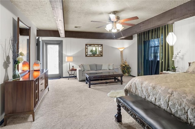 bedroom with ceiling fan, a textured ceiling, beam ceiling, and light colored carpet