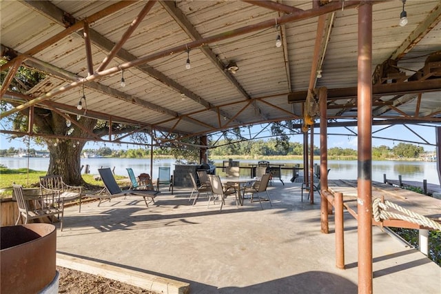 view of patio with a water view