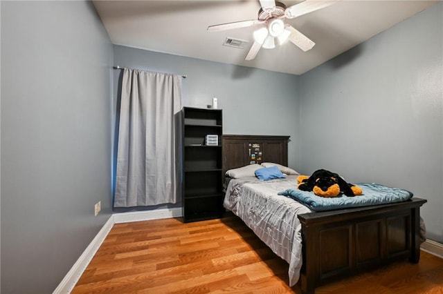 bedroom featuring hardwood / wood-style flooring and ceiling fan